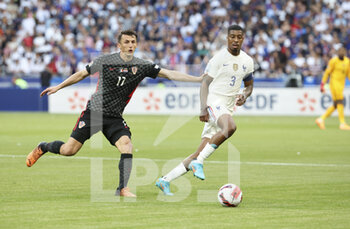 2022-06-13 - Ante Budimir of Croatia, Presnel Kimpembe of France during the UEFA Nations League, League A - Group 1 football match between France and Croatia on June 13, 2022 at Stade de France in Saint-Denis near Paris, France - FOOTBALL - NATIONS LEAGUE - FRANCE V CROATIA - UEFA NATIONS LEAGUE - SOCCER