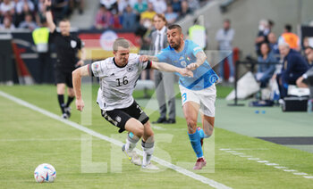 2022-06-14 - Lukas Klostermann of Germany and Leonardo Spinazzola of Italy during the UEFA Nations League 2022, League A - Group 3, football match between Germany and Italy on June 14, 2022 at Borussia-Park in Monchengladbach, Germany - FOOTBALL - NATIONS LEAGUE 2022 - GERMANY V ITALY - UEFA NATIONS LEAGUE - SOCCER