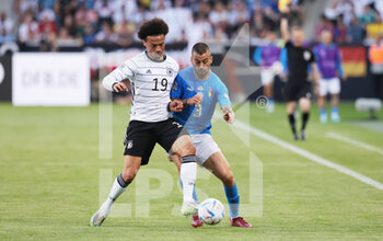 2022-06-14 - Leroy Sane of Germany and Leonardo Spinazzola of Italy during the UEFA Nations League 2022, League A - Group 3, football match between Germany and Italy on June 14, 2022 at Borussia-Park in Monchengladbach, Germany - FOOTBALL - NATIONS LEAGUE 2022 - GERMANY V ITALY - UEFA NATIONS LEAGUE - SOCCER