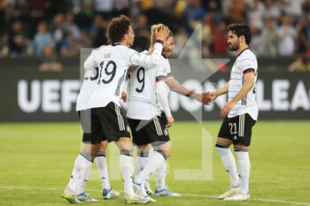 2022-06-14 - Timo Werner of Germany celebrates his goal 5-0 with Leroy Sane, Ilkay Gundogan during the UEFA Nations League 2022, League A - Group 3, football match between Germany and Italy on June 14, 2022 at Borussia-Park in Monchengladbach, Germany - FOOTBALL - NATIONS LEAGUE 2022 - GERMANY V ITALY - UEFA NATIONS LEAGUE - SOCCER