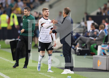 2022-06-14 - Germany head coach Hansi Flick with Timo Werner during the UEFA Nations League 2022, League A - Group 3, football match between Germany and Italy on June 14, 2022 at Borussia-Park in Monchengladbach, Germany - FOOTBALL - NATIONS LEAGUE 2022 - GERMANY V ITALY - UEFA NATIONS LEAGUE - SOCCER