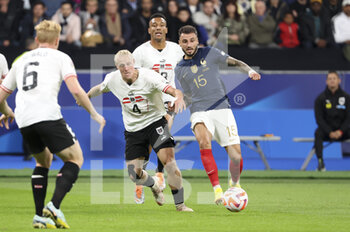 2022-09-22 - Jonathan Clauss of France, Xaver Schlager of Austria (left) during the UEFA Nations League, League A - Group 1 football match between France and Austria on September 22, 2022 at Stade de France in Saint-Denis near Paris, France - FOOTBALL - NATIONS LEAGUE - FRANCE V AUSTRIA - UEFA NATIONS LEAGUE - SOCCER