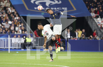 22/09/2022 - Raphael Varane of France, Karim Onisiwo of Austria (left) during the UEFA Nations League, League A - Group 1 football match between France and Austria on September 22, 2022 at Stade de France in Saint-Denis near Paris, France - FOOTBALL - NATIONS LEAGUE - FRANCE V AUSTRIA - UEFA NATIONS LEAGUE - CALCIO