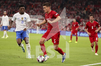 2022-09-25 - Joakim Maehle of Denmark, Aurelien Tchouameni of France (left) during the UEFA Nations League, League A - Group 1 football match between Denmark and France on September 25, 2022 at Parken Stadium in Copenhagen, Denmark - FOOTBALL - NATIONS LEAGUE - DENMARK V FRANCE - UEFA NATIONS LEAGUE - SOCCER