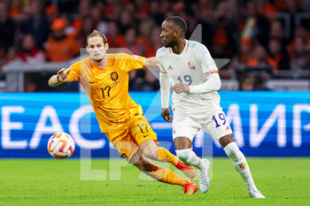 2022-09-25 - Daley Blind of The Netherlands, Dodi Lukebakio of Belgium during the UEFA Nations League, League A Group 4, football match between Netherlands and Belgium on September 25, 2022 at Johan Cruijff ArenA in Amsterdam, Netherlands - FOOTBALL - NATIONS LEAGUE - NETHERLANDS V BELGIUM - UEFA NATIONS LEAGUE - SOCCER