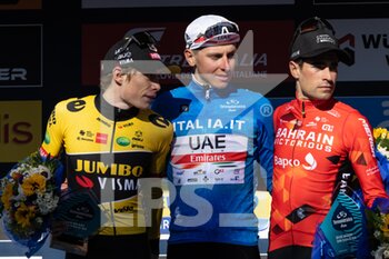 2022-03-13 - (L-R) Jonas Vingegaard Rasmussen of Denmark and Team Jumbo - Visma on second place, race winner Tadej Pogacar of Slovenia and UAE Team Emirates Blue Leader Jersey and Mikel Landa Meana of Spain and Team Bahrain Victorious on third place pose on the podium ceremony after the 57th Tirreno-Adriatico 2022 - Stage 7 a 159km stage from San Benedetto del Tronto to San Benedetto del Tronto / #TirrenoAdriatico / #WorldTour / on March 13, 2022 in San Benedetto del Tronto, Italy. - 7^ TAPPA SAN BENEDETTO DEL TRONTO - TIRRENO - ADRIATICO - CYCLING