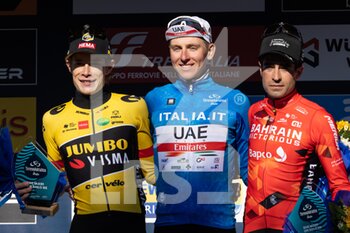 2022-03-13 - (L-R) Jonas Vingegaard Rasmussen of Denmark and Team Jumbo - Visma on second place, race winner Tadej Pogacar of Slovenia and UAE Team Emirates Blue Leader Jersey and Mikel Landa Meana of Spain and Team Bahrain Victorious on third place pose on the podium ceremony after the 57th Tirreno-Adriatico 2022 - Stage 7 a 159km stage from San Benedetto del Tronto to San Benedetto del Tronto / #TirrenoAdriatico / #WorldTour / on March 13, 2022 in San Benedetto del Tronto, Italy. - 7^ TAPPA SAN BENEDETTO DEL TRONTO - TIRRENO - ADRIATICO - CYCLING
