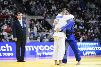 2022-02-06 - Men's -73 kg, Hashimoto Soichi of Japan hugs Fabio Basile of Italy after the fight during the Paris Grand Slam 2022, IJF World Judo Tour on February 5, 2022 at Accor Arena in Paris, France - PARIS GRAND SLAM 2022, IJF WORLD JUDO TOUR  - JUDO - CONTACT