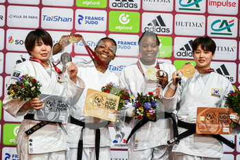 2022-02-06 - (LtoR) Japan's Umeki Mami (silver), France's Audrey Tcheumeo (gold), France's Madeleine Malonga (bronze) and Republic of Korea's Lee Jeongyun (bronze) pose during the podium ceremony of the women's -78kg category during the Paris Grand Slam 2022, IJF World Judo Tour on February 6, 2022 at Accor Arena in Paris, France - PARIS GRAND SLAM 2022, IJF WORLD JUDO TOUR  - JUDO - CONTACT