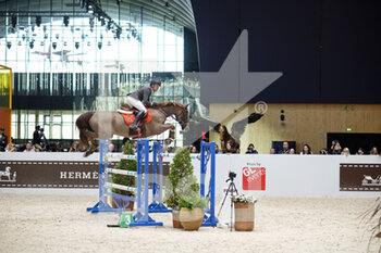 2022-03-18 - Simon DELESTRE (FRA) riding HERMES RYAN during the Prix Hermes Sellier at the Saut-Hermes 2022, equestrian FEI event on March 18, 2022 at the ephemeral Grand-palais in Paris, France - SAUT-HERMèS 2022, EQUESTRIAN FEI EVENT  - INTERNATIONALS - EQUESTRIAN