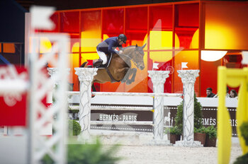 2022-03-19 - Roger-Yves BOST (FRA) riding BLUEMUCH DES BALEINES during the Prix GL Events at the Saut-Hermes 2022, equestrian FEI event on March 19, 2022 at the ephemeral Grand-palais in Paris, France - PRIX GL EVENTS AT THE SAUT-HERMES 2022, EQUESTRIAN FEI EVENT - INTERNATIONALS - EQUESTRIAN