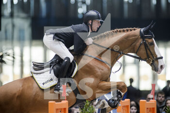 2022-03-19 - Marcus EHNING (GER) riding FUNKY FRED during the Saut Hermes prize at the Saut-Hermes 2022, equestrian FEI event on March 19, 2022 at the ephemeral Grand-palais in Paris, France - PRIX GL EVENTS AT THE SAUT-HERMES 2022, EQUESTRIAN FEI EVENT - INTERNATIONALS - EQUESTRIAN
