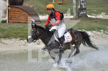 2022-09-17 - Katrin Khoddam-Hazrati (AUT) riding Oklahoma 2 during the cross-country course of the Equestrian FEI Eventing World Championships on September 17, 2022 at Pratoni del Vivaro, Rome, Italy - FEI EVENTING WORLD CHAMPIONSHIPS - INTERNATIONALS - EQUESTRIAN