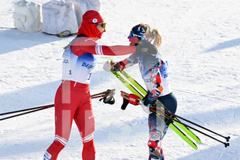 2022-02-05 - Natalia Nepryaeva (ROC) Silver Medal and Therese Johaug (NOR) Gold Medal during the Olympic Winter Games Beijing 2022, Cross-Country Skiing, Women's 7.5km + 7.5km Skiathlon on February 5, 2022 at Genting Snow Park in Zhangjiakou, Hebei Province of China - OLYMPIC WINTER GAMES BEIJING 2022, FEBRUARY 05 - OLYMPIC WINTER GAMES BEIJING 2022 - OLYMPIC GAMES