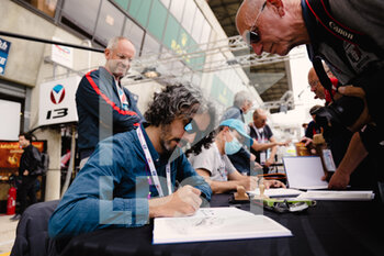 2022-06-10 - Autograph session of the new comics of Michel Vaillant with Benjamin Beneteau and Marc Bourgne during the free practices and qualifying sessions of the 2022 24 Hours of Le Mans, 3rd round of the 2022 FIA World Endurance Championship, on the Circuit de la Sarthe, from June 8 to 12, 2022 in Le Mans, France - 24 HEURES DU MANS 2022 - FREE PRACTICES AND QUALIFYING - PART 2 - ENDURANCE - MOTORS