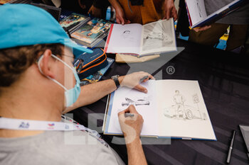 2022-06-10 - Autograph session of the new comics of Michel Vaillant with Benjamin Beneteau and Marc Bourgne during the free practices and qualifying sessions of the 2022 24 Hours of Le Mans, 3rd round of the 2022 FIA World Endurance Championship, on the Circuit de la Sarthe, from June 8 to 12, 2022 in Le Mans, France - 24 HEURES DU MANS 2022 - FREE PRACTICES AND QUALIFYING - PART 2 - ENDURANCE - MOTORS