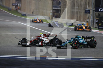 2022-03-20 - 24 ZHOU Guanyu (chi), Alfa Romeo F1 Team ORLEN C42, action 18 STROLL Lance (can), Aston Martin F1 Team AMR22, action during the Formula 1 Gulf Air Bahrain Grand Prix 2022, 1st round of the 2022 FIA Formula One World Championship, on the Bahrain International Circuit, from March 18 to 20, 2022 in Sakhir, Bahrain - FORMULA 1 GULF AIR BAHRAIN GRAND PRIX 2022, 1ST ROUND OF THE 2022 FIA FORMULA ONE WORLD CHAMPIONSHIP - FORMULA 1 - MOTORS