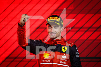 2022-03-20 - LECLERC Charles (mco), Scuderia Ferrari F1-75, portrait celebrating victory on the podium during the Formula 1 Gulf Air Bahrain Grand Prix 2022, 1st round of the 2022 FIA Formula One World Championship, on the Bahrain International Circuit, from March 18 to 20, 2022 in Sakhir, Bahrain - FORMULA 1 GULF AIR BAHRAIN GRAND PRIX 2022, 1ST ROUND OF THE 2022 FIA FORMULA ONE WORLD CHAMPIONSHIP - FORMULA 1 - MOTORS