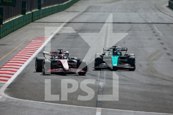 2022-06-12 - 20 MAGNUSSEN Kevin (den), Haas F1 Team VF-22 Ferrari, 18 STROLL Lance (can), Aston Martin F1 Team AMR22, action during the Formula 1 Azerbaijan Grand Prix 2022, 8th round of the 2022 FIA Formula One World Championship, on the Baku City Circuit, from June 10 to 12, 2022 in Baku, Azerbaijan - F1 - AZERBAIJAN GRAND PRIX 2022 - RACE - FORMULA 1 - MOTORS