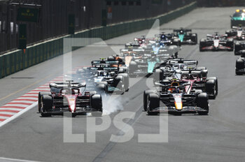 2022-06-12 - 16 LECLERC Charles (mco), Scuderia Ferrari F1-75, action 11 PEREZ Sergio (mex), Red Bull Racing RB18, action start of the race, depart, during the Formula 1 Azerbaijan Grand Prix 2022, 8th round of the 2022 FIA Formula One World Championship, on the Baku City Circuit, from June 10 to 12, 2022 in Baku, Azerbaijan - F1 - AZERBAIJAN GRAND PRIX 2022 - RACE - FORMULA 1 - MOTORS
