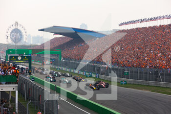 2022-09-04 - start of the race, depart, 01 VERSTAPPEN Max (nld), Red Bull Racing RB18, 16 LECLERC Charles (mco), Scuderia Ferrari F1-75, action grandstands, gradins, spectators, fans during the Formula 1 Heineken Dutch Grand Prix 2022, 15th round of the 2022 FIA Formula One World Championship from September 2 to 4, 2022 on the Zandvoort Circuit, in Netherlands, Belgium - F1 - DUTCH GRAND PRIX 2022 - RACE - FORMULA 1 - MOTORS