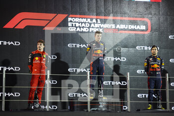 2022-11-20 - Podium, LECLERC Charles (mco), Scuderia Ferrari F1-75, VERSTAPPEN Max (ned), Red Bull Racing RB18, PEREZ Sergio (mex), Red Bull Racing RB18, portrait during the Formula 1 Etihad Airways Abu Dhabi Grand Prix 2022, 22nd round of the 2022 FIA Formula One World Championship from November 18 to 20, 2022 on the Yas Marina Circuit, in Yas Island, Abu Dhabi - F1 - ABU DHABI GRAND PRIX 2022 - RACE - FORMULA 1 - MOTORS