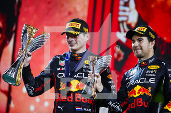 2022-11-20 - VERSTAPPEN Max (ned), Red Bull Racing RB18, PEREZ Sergio (mex), Red Bull Racing RB18, portrait on the podium during the Formula 1 Etihad Airways Abu Dhabi Grand Prix 2022, 22nd round of the 2022 FIA Formula One World Championship from November 18 to 20, 2022 on the Yas Marina Circuit, in Yas Island, Abu Dhabi - F1 - ABU DHABI GRAND PRIX 2022 - RACE - FORMULA 1 - MOTORS
