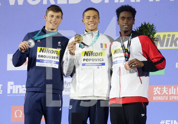 2022-06-22 - Maxime Grousset of France Silver medal, David Popovici of Romania Gold medal, Joshua Liendo Edwards of Canada Bronze medal, 100 M Freestyle Men during the 19th FINA World Championships Budapest 2022, Swimming event on June 22 2022 in Budapest, Hungary - SWIMMING - FINA WORLD CHAMPIONSHIPS BUDAPEST 2022 - SWIMMING - SWIMMING