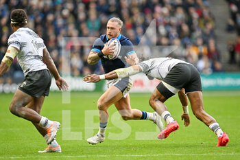 05/11/2022 - Scotland's Stuart Hogg tries to sidestep Fiji’s Waisea Nayacalevu during the 2022 Autumn Nations Series, rugby union test match between Scotland and Fiji on November 5, 2022 at BT Murrayfield Stadium in Edinburgh, Scotland - RUGBY - TEST MATCH - SCOTLAND V FIJI - AUTUMN NATIONS SERIES - RUGBY