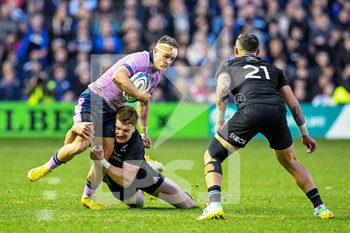 13/11/2022 - Scotland's Darcy Graham is tackled by New Zealand’s Jordie Barrett during the 2022 Autumn Nations Series, rugby union test match between Scotland and New Zealand on November 13, 2022 at the BT Murrayfield Stadium in Edinburgh, Scotland - RUGBY - TEST MATCH - SCOTLAND V NEW ZEALAND - AUTUMN NATIONS SERIES - RUGBY