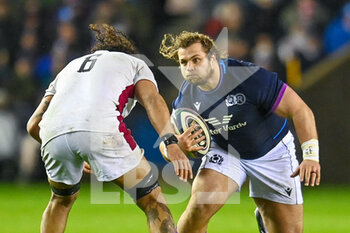 2022-02-05 - Scotland's Pierre Schoeman runs at England's Lewis Ludlum during the Six Nations 2022 rugby union match between Scotland and England on February 5, 2022 at BT Murrayfield in Edinburgh, Scotland - SIX NATIONS 2022 - SCOTLAND VS ENGLAND - SIX NATIONS - RUGBY