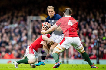 2022-02-12 - Duhan van der Merwe of Scotland under pressure from Will Rowlands of Wales during the Six Nations 2022, rugby union match between Wales and Scotland on February 12, 2022 at Principality Stadium in Cardiff, Wales - SIX NATIONS 2022 - WALES VS SCOTLAND - SIX NATIONS - RUGBY