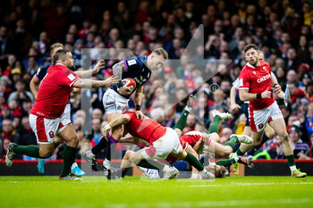2022-02-12 - Stuart Hogg of Scotland is tackled by Dan Biggar of Wales during the Six Nations 2022, rugby union match between Wales and Scotland on February 12, 2022 at Principality Stadium in Cardiff, Wales - SIX NATIONS 2022 - WALES VS SCOTLAND - SIX NATIONS - RUGBY