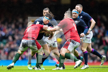 2022-02-12 - Hamish Watson of Scotland is tackled by Jac Morgan of Wales during the Six Nations 2022, rugby union match between Wales and Scotland on February 12, 2022 at Principality Stadium in Cardiff, Wales - SIX NATIONS 2022 - WALES VS SCOTLAND - SIX NATIONS - RUGBY