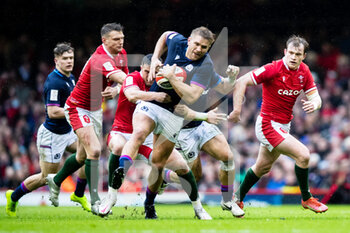 2022-02-12 - Chris Harris of Scotland under pressure from Nick Tompkins of Wales during the Six Nations 2022, rugby union match between Wales and Scotland on February 12, 2022 at Principality Stadium in Cardiff, Wales - SIX NATIONS 2022 - WALES VS SCOTLAND - SIX NATIONS - RUGBY