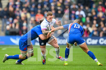 2022-02-26 - Scotland Captain, Stuart Hogg is tackled by France's Anthony Jelonch and France's Gael Fickou during the Six Nations 2022, rugby union match between Scotland and France on February 26, 2022 at BT Murrayfield Stadium in Edinburgh, Scotland - SIX NATIONS 2022 - SCOTLAND VS FRANCE - SIX NATIONS - RUGBY