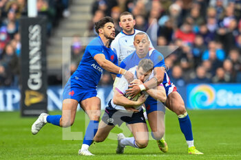 2022-02-26 - Scotland's Mark Bennett is tackled by France's Gael Fickou and France's Romain Ntamack during the Six Nations 2022, rugby union match between Scotland and France on February 26, 2022 at BT Murrayfield Stadium in Edinburgh, Scotland - SIX NATIONS 2022 - SCOTLAND VS FRANCE - SIX NATIONS - RUGBY
