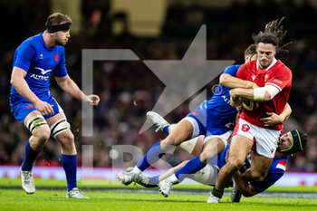 2022-03-11 - Josh Navidi of Wales is tackled by Romain Ntamack, Gregory Alldritt of France during the Six Nations 2022 rugby union match between Wales and France on March 11, 2022 at Principality Stadium in Cardiff, Wales - SIX NATIONS 2022 - WALES VS FRANCE - SIX NATIONS - RUGBY