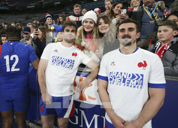 2022-03-20 - Damian Penaud, Thomas Ramos of France celebrate the Grand Slam victory following the Six Nations 2022 rugby union match between France and England on March 19, 2022 at Stade de France in Saint-Denis near Paris, France - SIX NATIONS 2022 - FRANCE VS ENGLAND - SIX NATIONS - RUGBY