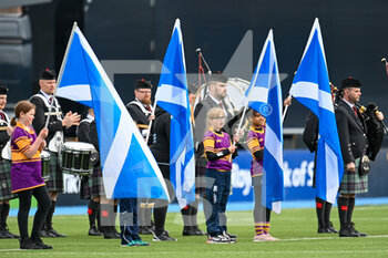 2022-04-10 - The Scottish flag bearers and pipe band await the arrival of the teams before the Women’s Six Nations 2022, rugby union match between Scotland and France on April 10, 2022 at Scotstoun Stadium in Glasgow, Scotland - WOMEN’S SIX NATIONS 2022 - SCOTLAND VS FRANCE - SIX NATIONS - RUGBY
