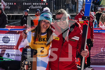 2022-02-27 - CRANS-MONTANA, SWITZERLAND - FEBRUARY 27: Priska Nufer of Switzerland (1st place) with ki man Marco Jermini during the Audi FIS Alpine Ski World Cup Crans-Montana Women’s Downhill on February 27, 2022 in Crans-Montana, Switzerland. - AUDI FIS ALPINE SKI WORLD CUP CRANS-MONTANA WOMEN'S DOWNHILL - ALPINE SKIING - WINTER SPORTS