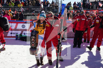 2022-02-27 - CRANS-MONTANA, SWITZERLAND - FEBRUARY 27: Priska Nufer of Switzerland (1st place) with ki man Marco Jermini during the Audi FIS Alpine Ski World Cup Crans-Montana Women’s Downhill on February 27, 2022 in Crans-Montana, Switzerland. - AUDI FIS ALPINE SKI WORLD CUP CRANS-MONTANA WOMEN'S DOWNHILL - ALPINE SKIING - WINTER SPORTS