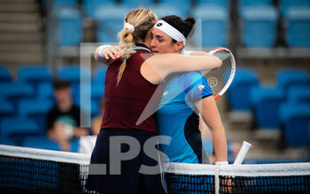 2022-01-12 - Anett Kontaveit of Estonia & Ons Jabeur of Tunisia at the net after Jabeur was forced to retire from the quarter-final of the 2022 Sydney Tennis Classic, WTA 500 tennis tournament on January 13, 2022 at NSW Tennis Centre in Sydney, Australia - 2022 SYDNEY TENNIS CLASSIC, WTA 500 TENNIS TOURNAMENT - INTERNATIONALS - TENNIS