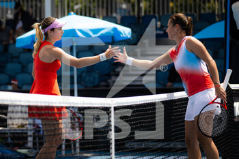 2022-01-18 - Stefanie Voegele of Switzerland & Daria Kasatkina of Russia in action during the first round of the 2022 Australian Open, WTA Grand Slam tennis tournament on January 18, 2022 at Melbourne Park in Melbourne, Australia - 2022 AUSTRALIAN OPEN, WTA GRAND SLAM TENNIS TOURNAMENT - INTERNATIONALS - TENNIS