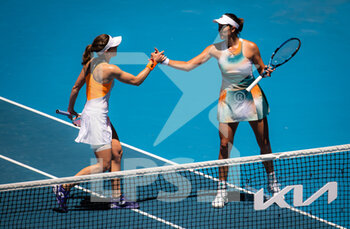 2022-01-19 - Alize Cornet of France & Garbine Muguruza of Spain in action during the second round of the 2022 Australian Open, WTA Grand Slam tennis tournament on January 20, 2022 at Melbourne Park in Melbourne, Australia - 2022 AUSTRALIAN OPEN, WTA GRAND SLAM TENNIS TOURNAMENT - INTERNATIONALS - TENNIS