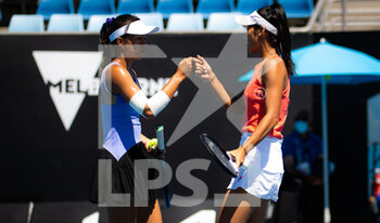 2022-01-20 - Priscilla Hon of Australia & Lizette Cabrera of Australia in action during the second round of doubles at the 2022 Australian Open, WTA Grand Slam tennis tournament on January 21, 2022 at Melbourne Park in Melbourne, Australia - 2022 AUSTRALIAN OPEN, WTA GRAND SLAM TENNIS TOURNAMENT - INTERNATIONALS - TENNIS