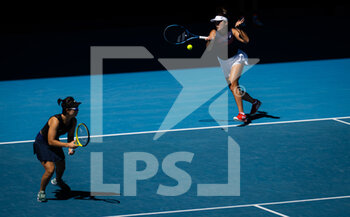 2022-01-23 - Zhaoxuan Yang of China & Yifan Xu of China in action during the third doubles round at the 2022 Australian Open, WTA Grand Slam tennis tournament on January 23, 2022 at Melbourne Park in Melbourne, Australia - 2022 AUSTRALIAN OPEN, WTA GRAND SLAM TENNIS TOURNAMENT - INTERNATIONALS - TENNIS