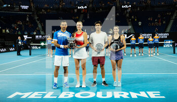 2022-01-28 - Ivan Dodig of Croatia & Kristina Mladenovic of France and Jason Kubler of Australia & Jaimee Fourlis of Australia pose with their trophies after the mixed doubles final of the 2022 Australian Open, Grand Slam tennis tournament on January 28, 2022 at Melbourne Park in Melbourne, Australia - 2022 AUSTRALIAN OPEN, GRAND SLAM TENNIS TOURNAMENT - INTERNATIONALS - TENNIS