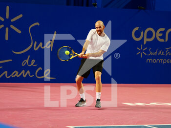 2022-02-02 - Adrian Mannarino of France in action against Alejandro Davidovich Fokina of Spain during the Open Sud de France 2022, ATP 250 tennis tournament on February 2, 2022 at Sud de France Arena in Montpellier, France - OPEN SUD DE FRANCE 2022, ATP 250 TENNIS TOURNAMENT - INTERNATIONALS - TENNIS
