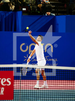 2022-02-02 - Filip Krajinovic of Serbia in action against Jo-Wilfried Tsonga of France during the Open Sud de France 2022, ATP 250 tennis tournament on February 2, 2022 at Sud de France Arena in Montpellier, France - OPEN SUD DE FRANCE 2022, ATP 250 TENNIS TOURNAMENT - INTERNATIONALS - TENNIS